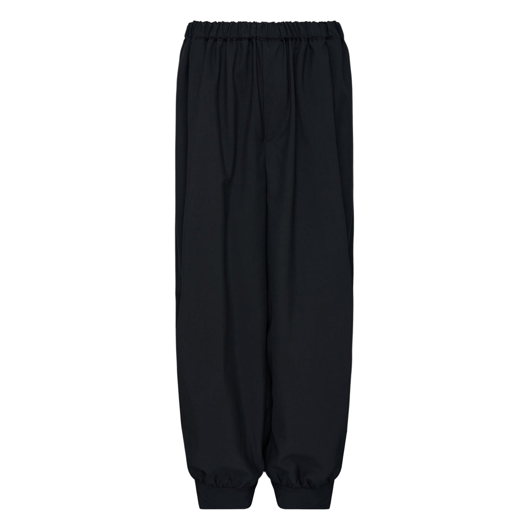 Comme des Garçons Black cuffed hem elastic waistband pants in black with wide-leg silhouette and elasticated ankles