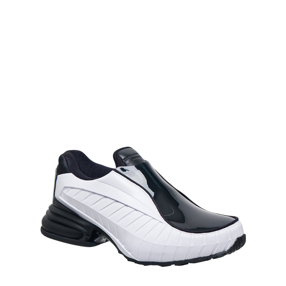 Comme des Garçons Homme Plus x Nike Air Max Dolce SP CDG all-black leather slip-on sneaker with ribbed panelling and chunky sole, lateral view