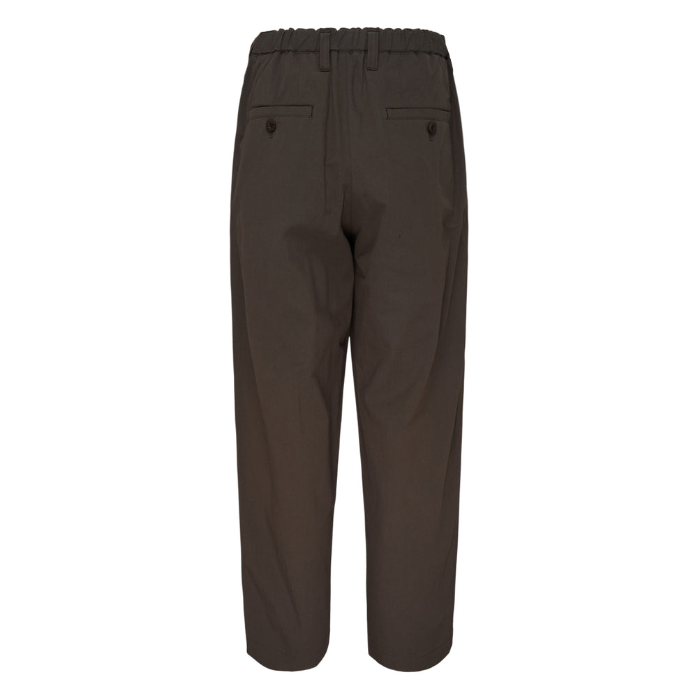 Im Men Navy Bottoms — dark brown relaxed tapered woven trousers with pleated front and single button waistband closure
