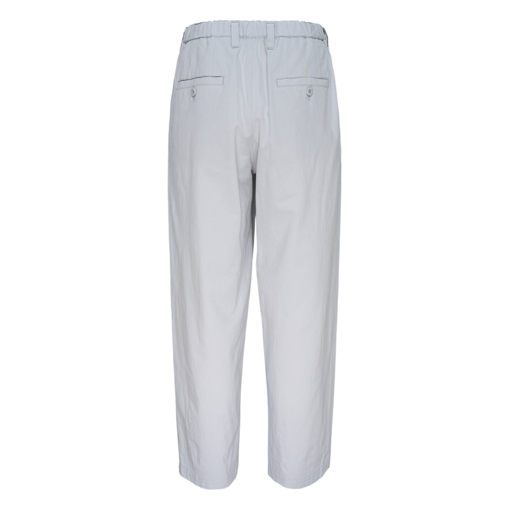 Im Men Navy Bottoms — dark brown relaxed tapered woven trousers with pleated front and single button waistband closure