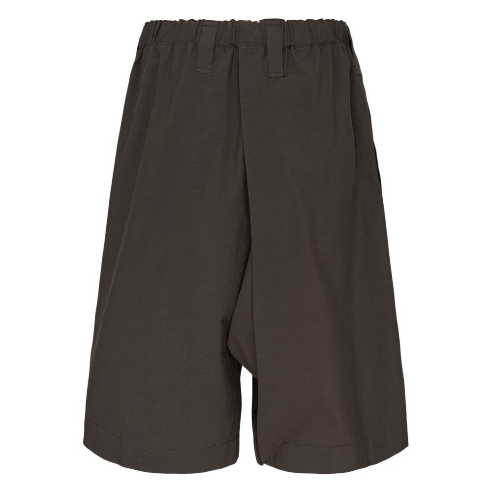 IM MEN Navy Bottoms — wide-leg shorts in deep blue with elasticated waistband, belt loops, utility patch pocket, and rolled hem cuffs