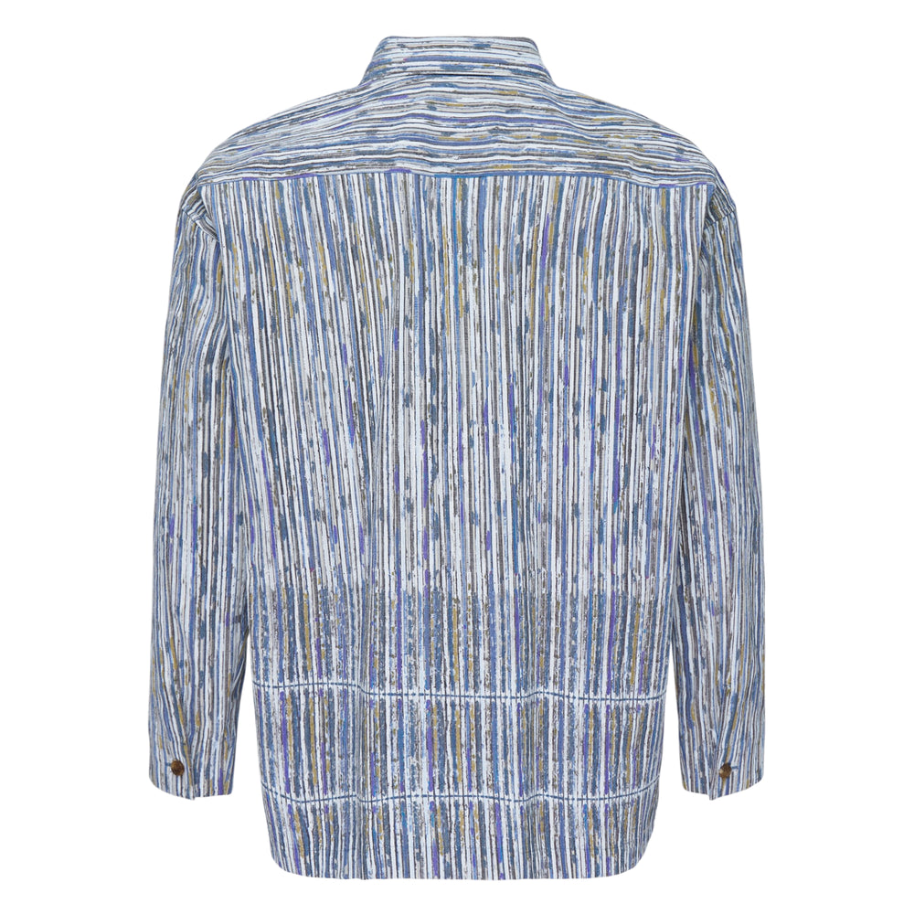 IM MEN Curviness Long Sleeve Shirt in a painterly vertical stripe print of blue, white, and khaki tones with brown buttons and a relaxed overshirt silhouette