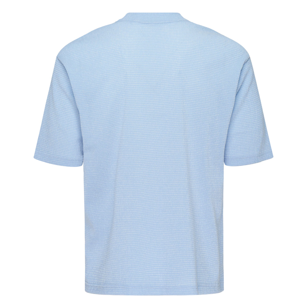 IM MEN Shrink Stretch T in sky blue — oversized crew-neck short sleeve tee with fine grid-textured stretch fabric, front view on white background