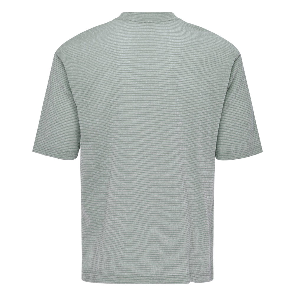 IM MEN Shrink Stretch T in sky blue — oversized crew-neck short sleeve tee with fine grid-textured stretch fabric, front view on white background