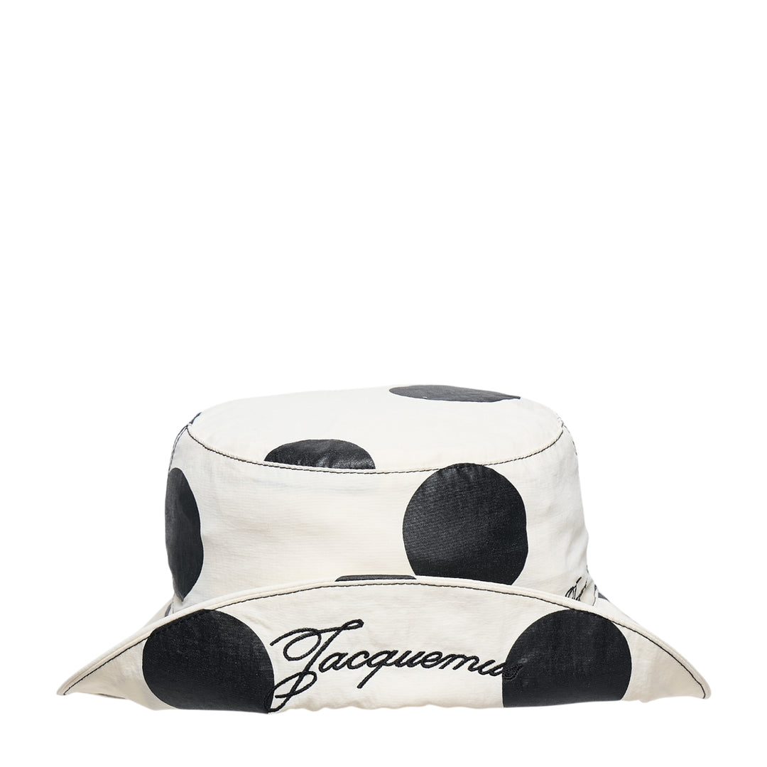 Jacquemus Le Bob Baluchon bucket hat in off-white with large black polka dots, featuring a wide brim with contrast topstitching and script logo detail - view 4