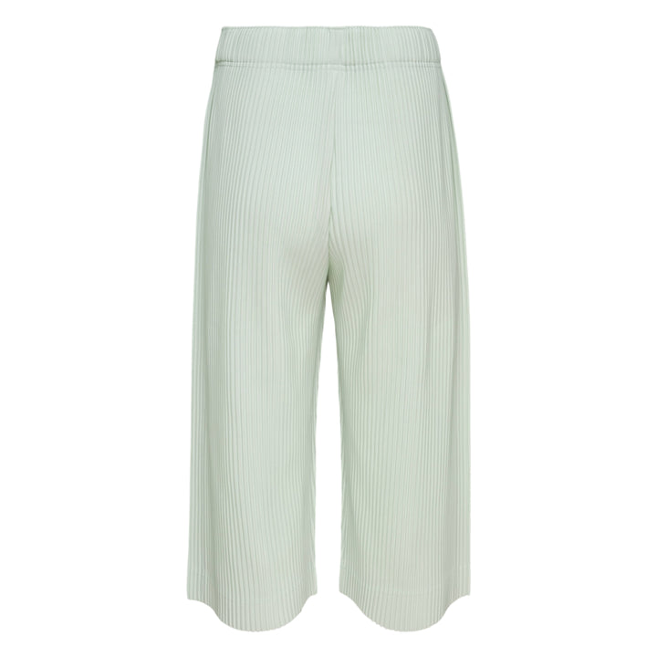 Homme Plissé Issey Miyake Monthly Colors May black accordion pleated wide-leg cropped pants with elastic waistband, front view on white background