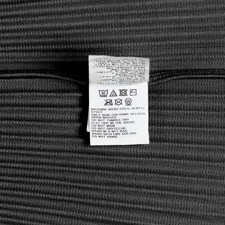 Homme Plissé Issey Miyake Monthly Colors May Pleated Top in lime green with all-over horizontal pleating and lace-up spread collar