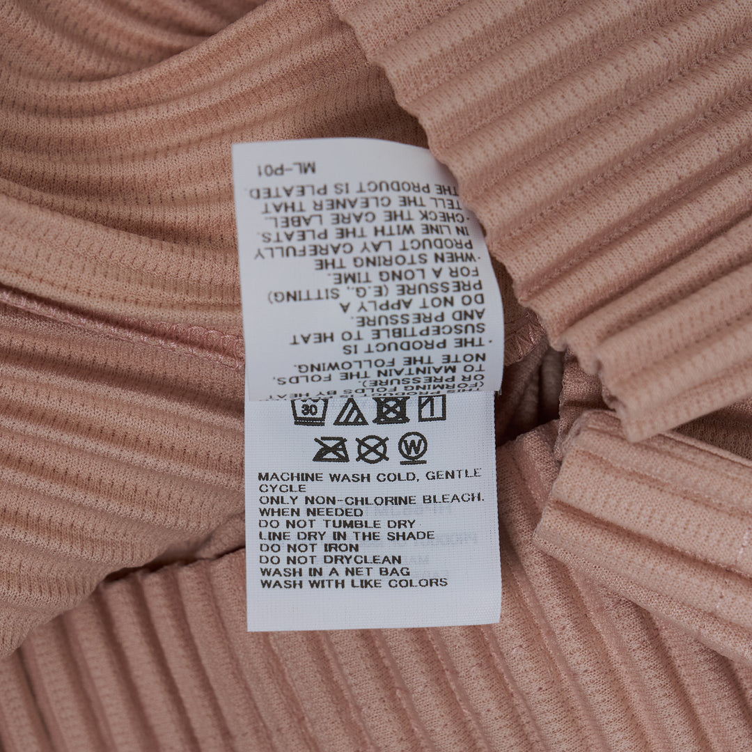 Homme Plissé Issey Miyake Color Pleats 2 Pleated Polo in blush pink with all-over vertical pleating and zip collar