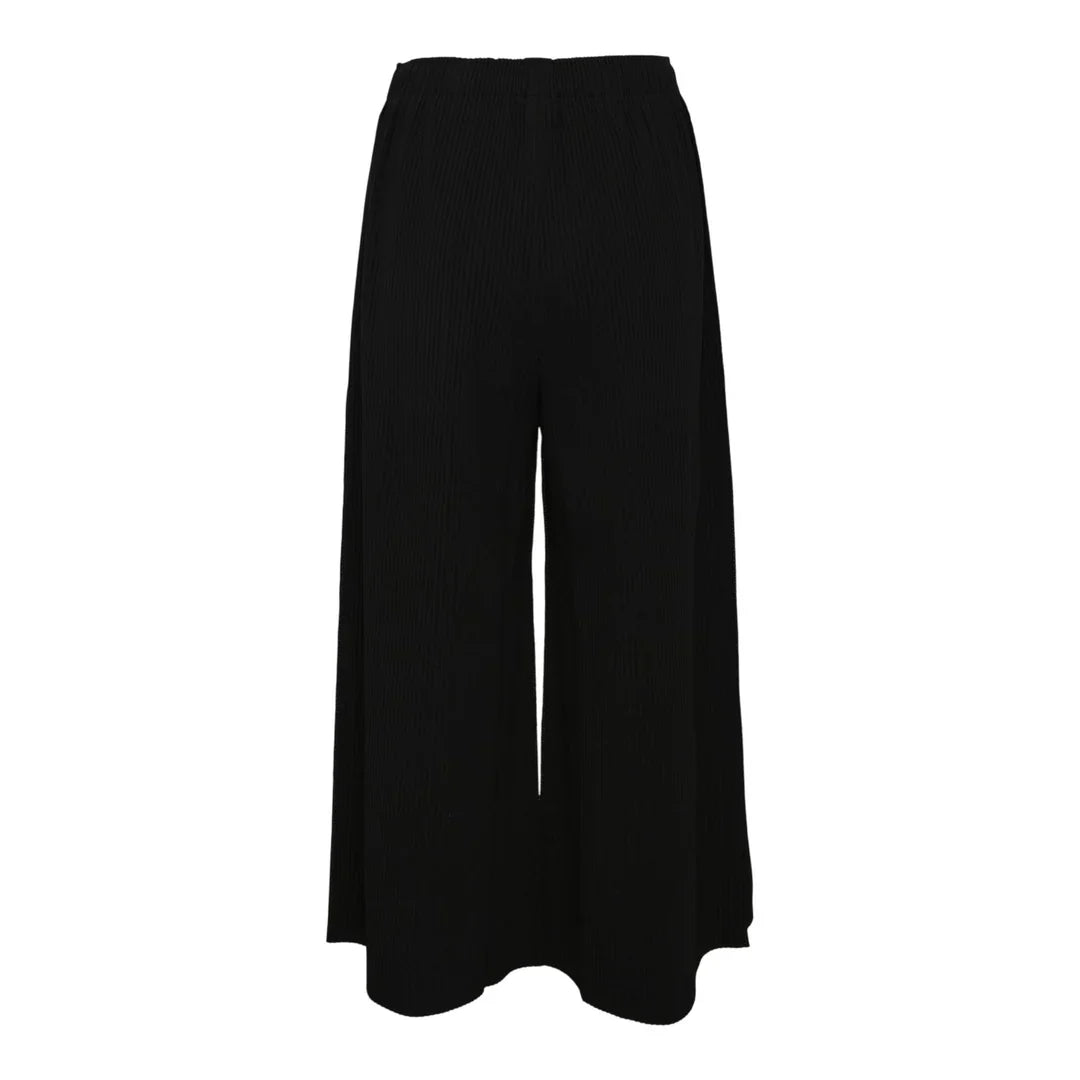 me Issey Miyake Fine Knit Pleated Wide Pants in black with elastic waistband and wide-leg silhouette, front view