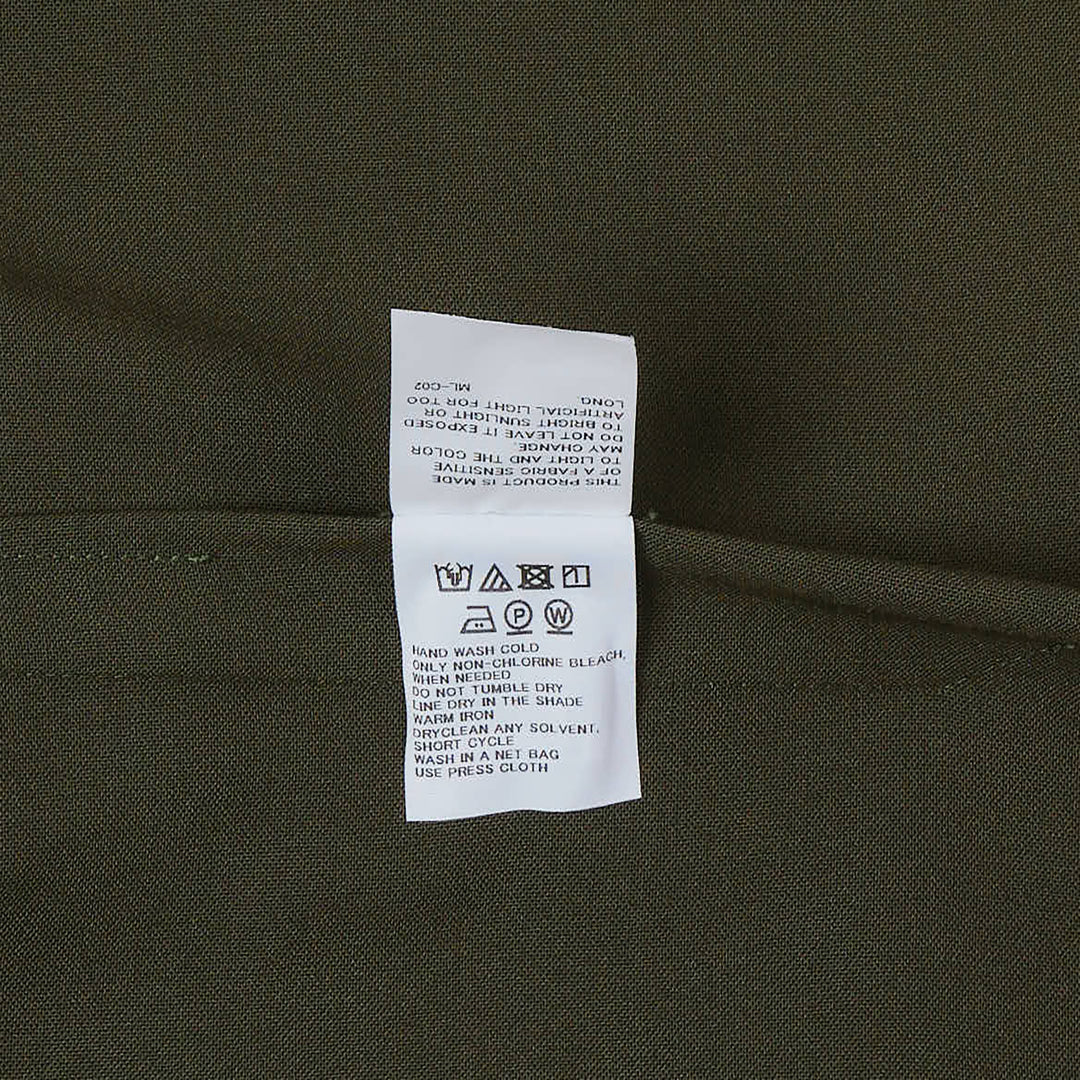 132 5. Issey Miyake draped cowl neck sleeveless woven dress in deep olive green with asymmetric overlay panel and architectural silhouette