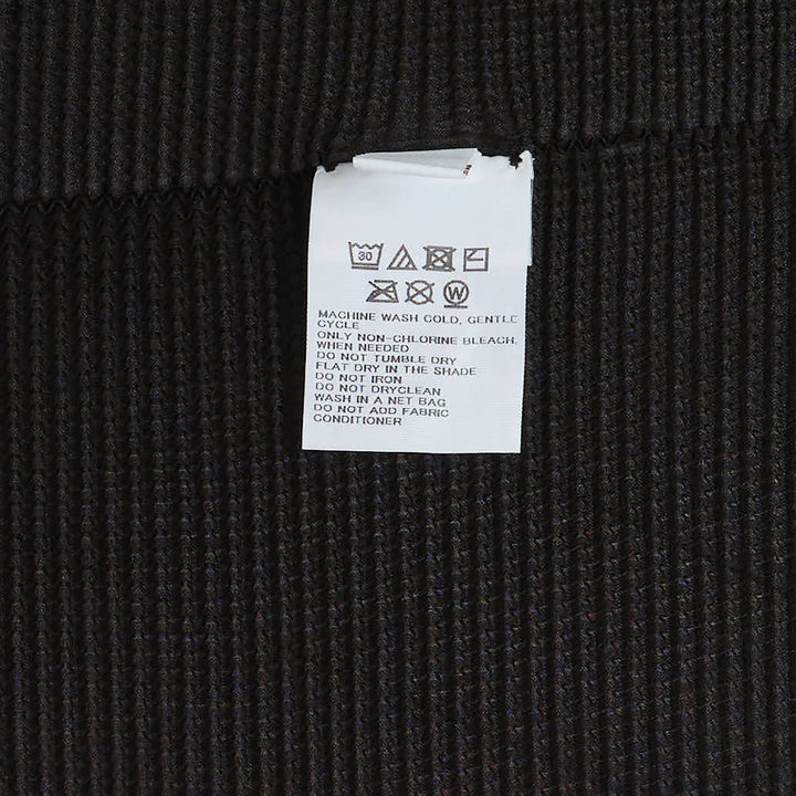 me Issey Miyake Square Stretch Pleated Cardigan in black with boxy silhouette, short sleeves, spread collar, and button placket