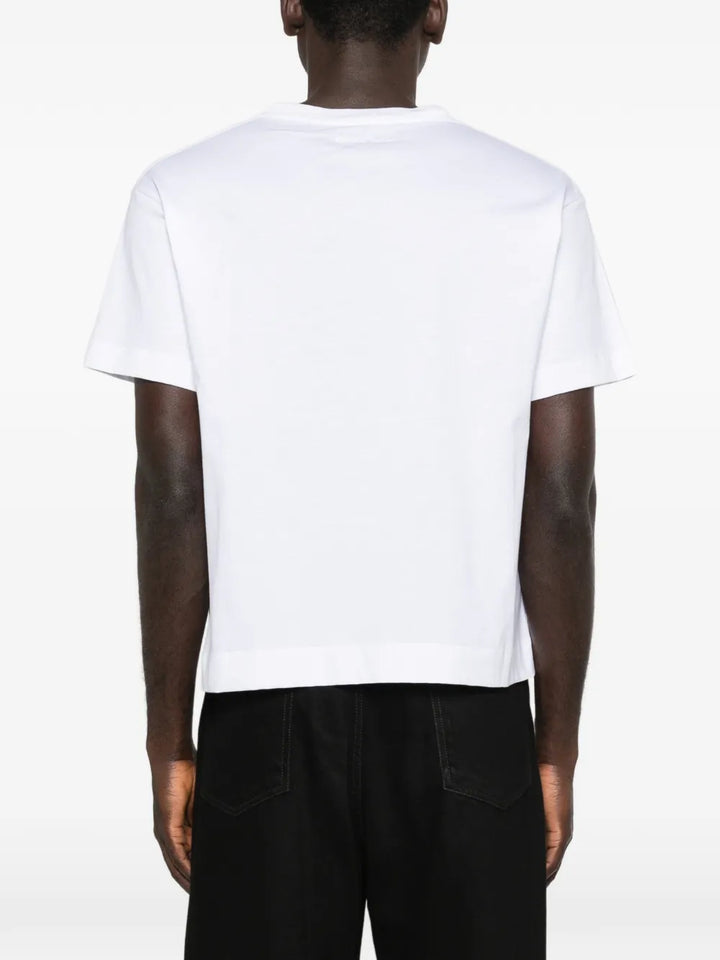 Simone Rocha Pressed Rosette T-Shirt in blush pink with tonal 3D rose appliqué and ribbon detail at chest, flat lay on white background