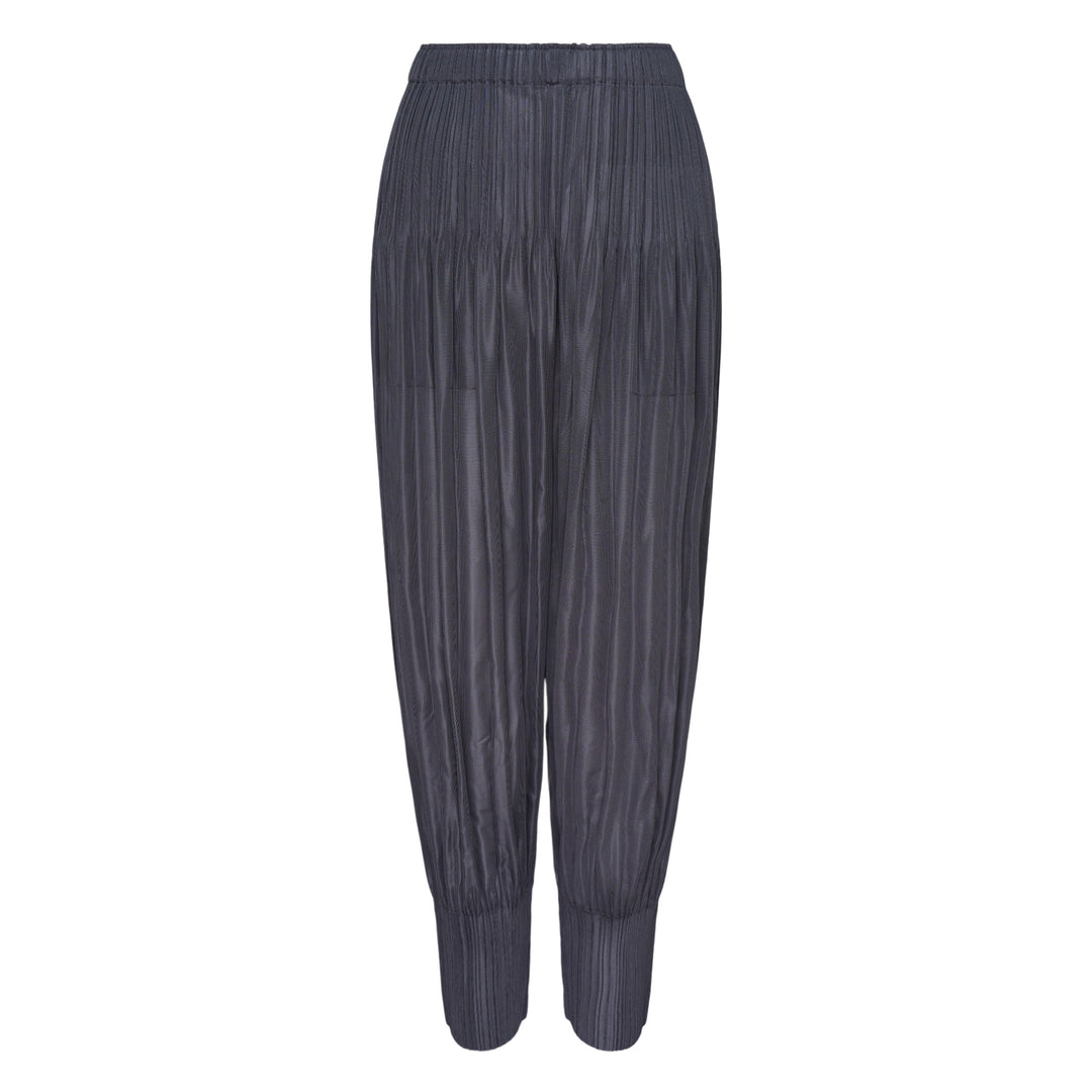 Pleats Please Issey Miyake Fluffy Basics Pleated Pants in charcoal grey with vertical pleating, relaxed harem silhouette, elasticated waist and cuffs
