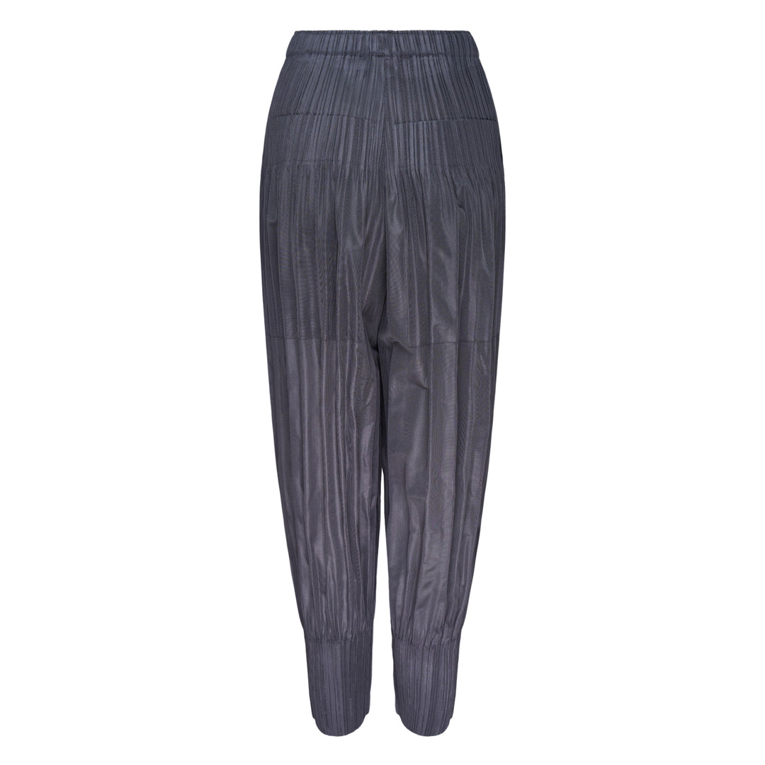 Pleats Please Issey Miyake Fluffy Basics Pleated Pants in charcoal grey with vertical pleating, relaxed harem silhouette, elasticated waist and cuffs