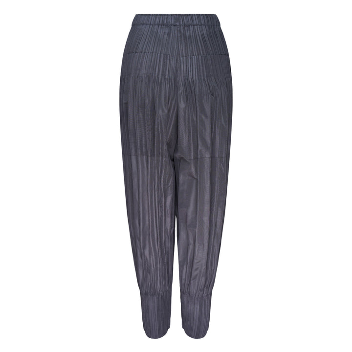 Pleats Please Issey Miyake Fluffy Basics Pleated Pants in charcoal grey with vertical pleating, relaxed harem silhouette, elasticated waist and cuffs
