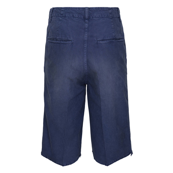 visvim Broader Chino Crash Shorts in washed navy blue with button fly, distressed cut-out detailing, and raw frayed hem