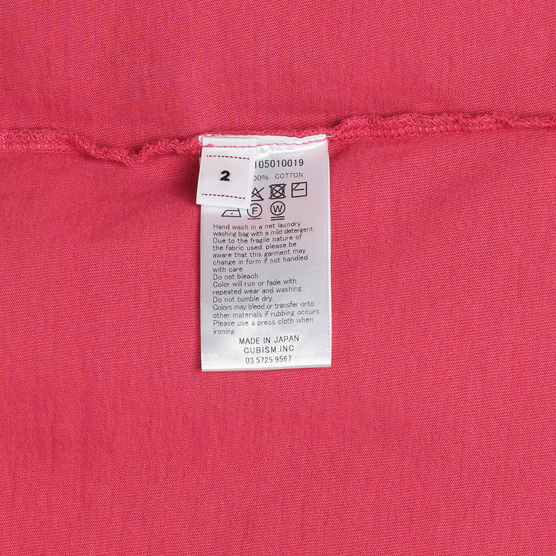 visvim Mondo S/S Damaged Cotton Tee in raspberry pink with mock neck, dropped shoulders, and chest patch pocket