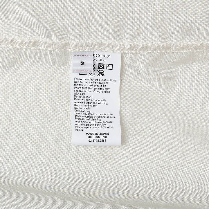 visvim Copa Short Sleeve Silk Shirt in off-white with camp collar, chest pocket, and embroidered script logo