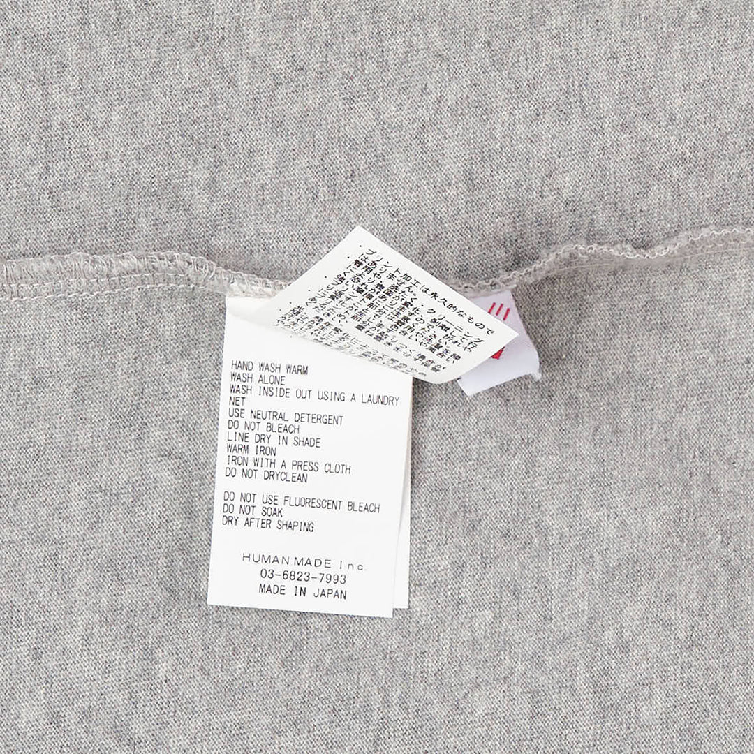 Human Made Baseball Graphic T-Shirt in heather grey, featuring an illustrated group of bear characters in baseball uniforms spelling out Human Made, with the brand wordmark printed below the graphic