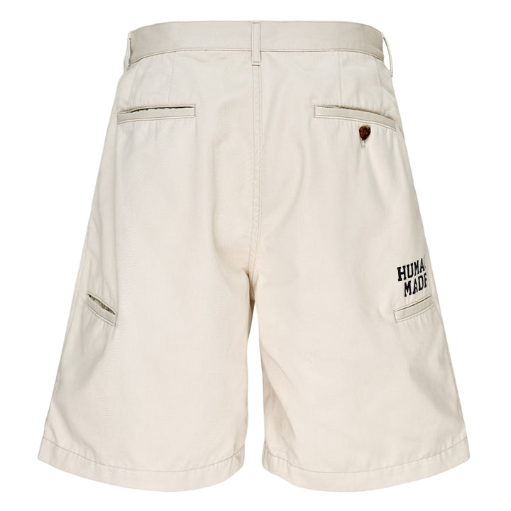 Human Made Skater Shorts in black with embroidered heart-and-arrow logo near the hem and yellow woven brand label at the waistband