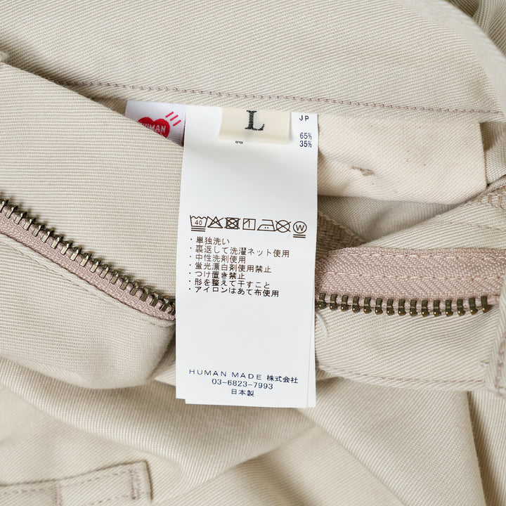 Human Made Skater Shorts in black with embroidered heart-and-arrow logo near the hem and yellow woven brand label at the waistband