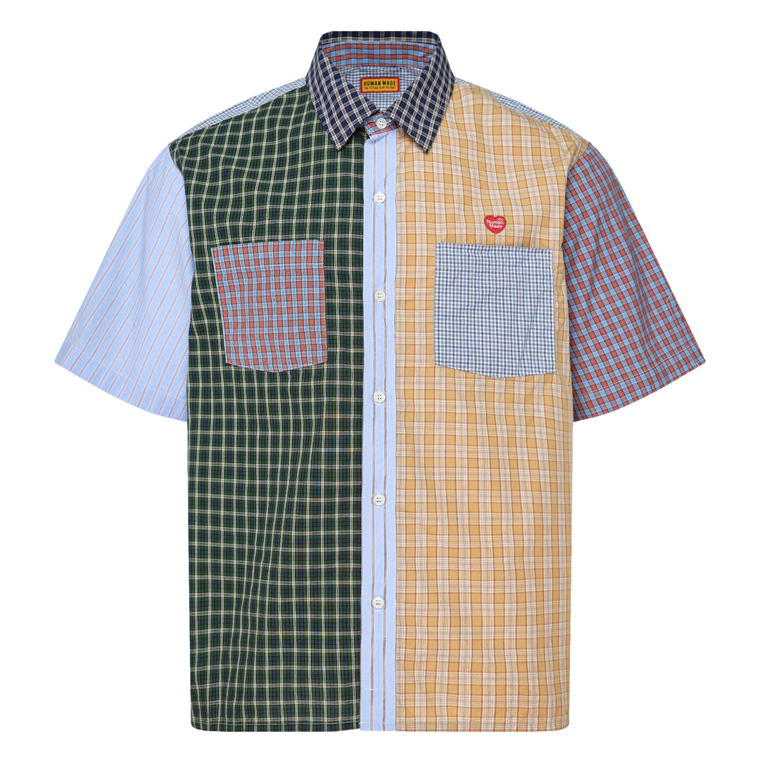 Human Made Crazy Check Short Sleeve Shirt featuring patchwork multi-check and plaid panels in green, yellow, blue, and navy, with contrast chest pockets and an embroidered heart logo patch