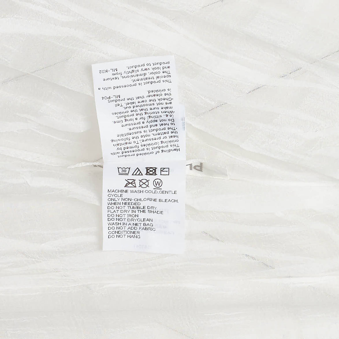 Pleats Please Issey Miyake Twisted Border Shirt in sheer black pleated fabric with horizontal stripe pattern and short sleeves, flat lay front view