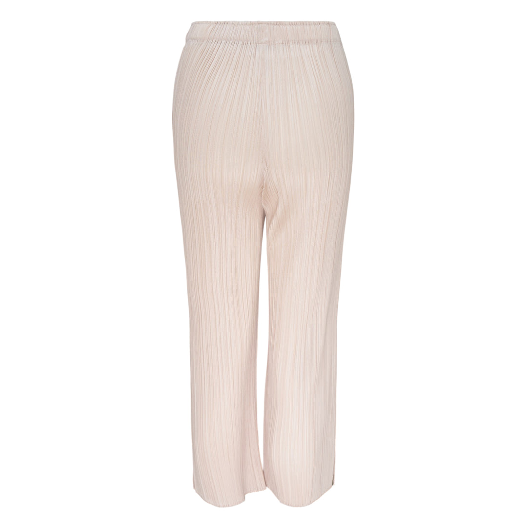 Pleats Please Issey Miyake Monthly Colors May Pants in soft blush pink with vertical micro-pleating and an elasticated waistband, straight-leg silhouette on a white background.