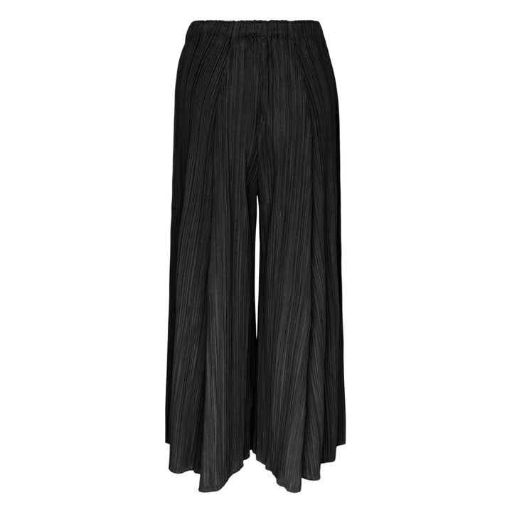 Pleats Please Issey Miyake Mellow Pleats Pants in black, featuring a wide-leg silhouette, fine vertical pleating, and an elasticated waistband, displayed flat on a white background.