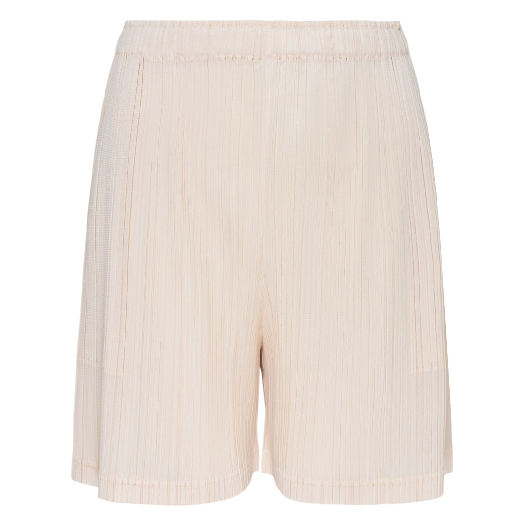Pleats Please Issey Miyake Loop Pleated Shorts in cream with vertical micro-pleating and elasticated waistband, front view on white background