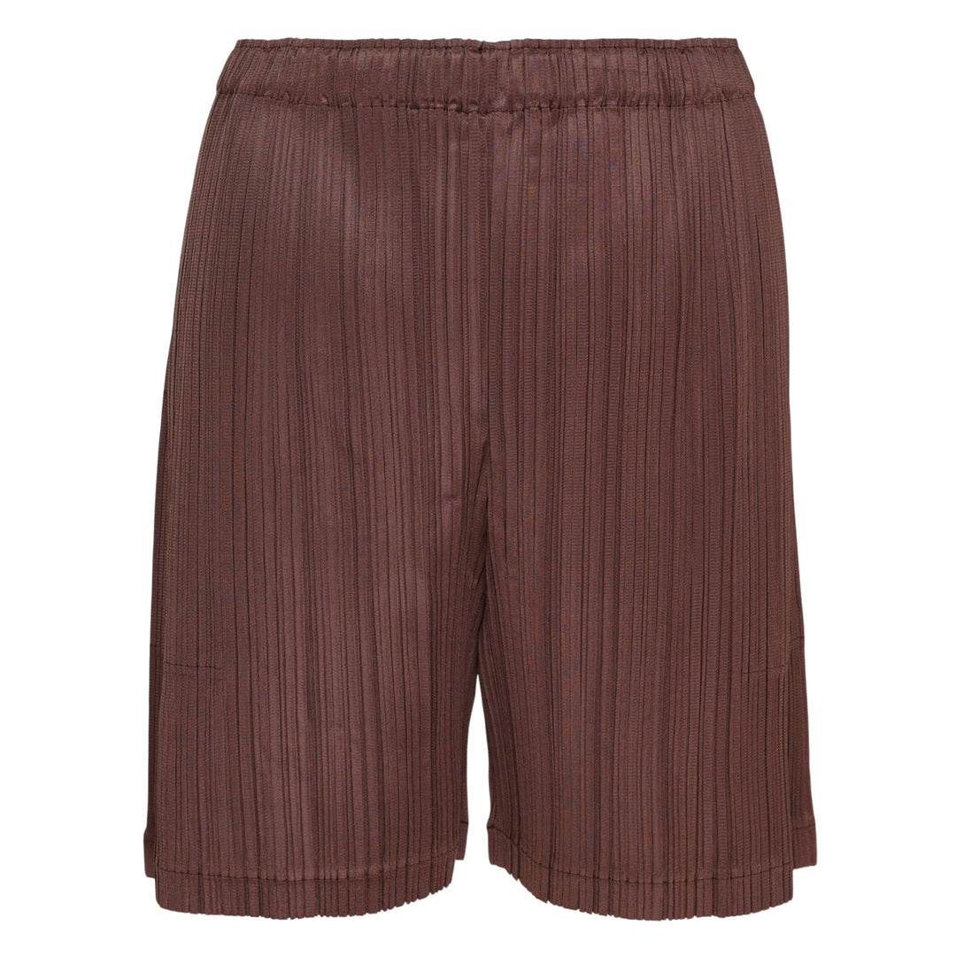 Pleats Please Issey Miyake Loop Pleated Shorts in cream with vertical micro-pleating and elasticated waistband, front view on white background