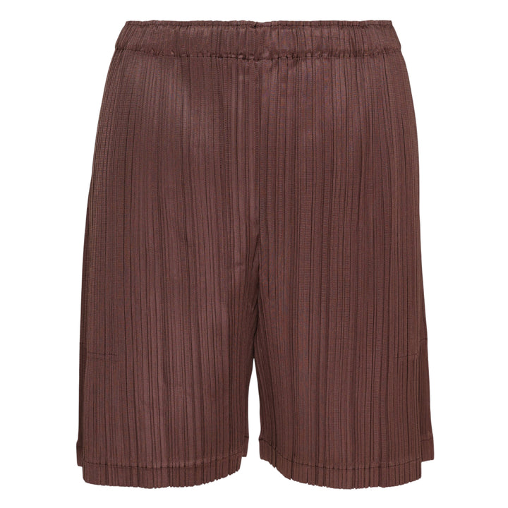 Pleats Please Issey Miyake Loop Pleated Shorts in cream with vertical micro-pleating and elasticated waistband, front view on white background