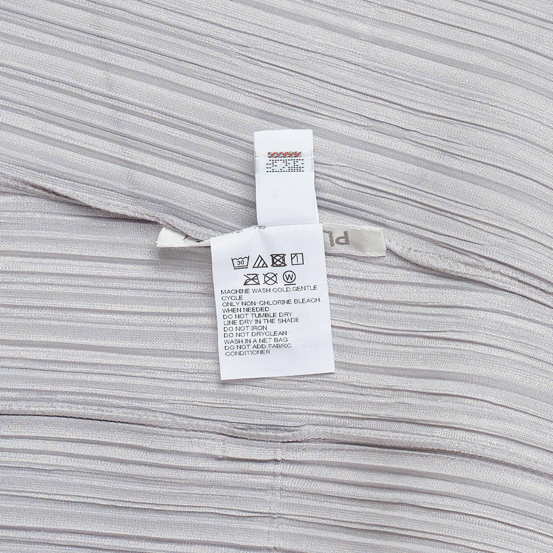 Pleats Please Issey Miyake Mellow Pleats Dress in silver-grey with fine vertical pleating, round neckline and short sleeves, midi length