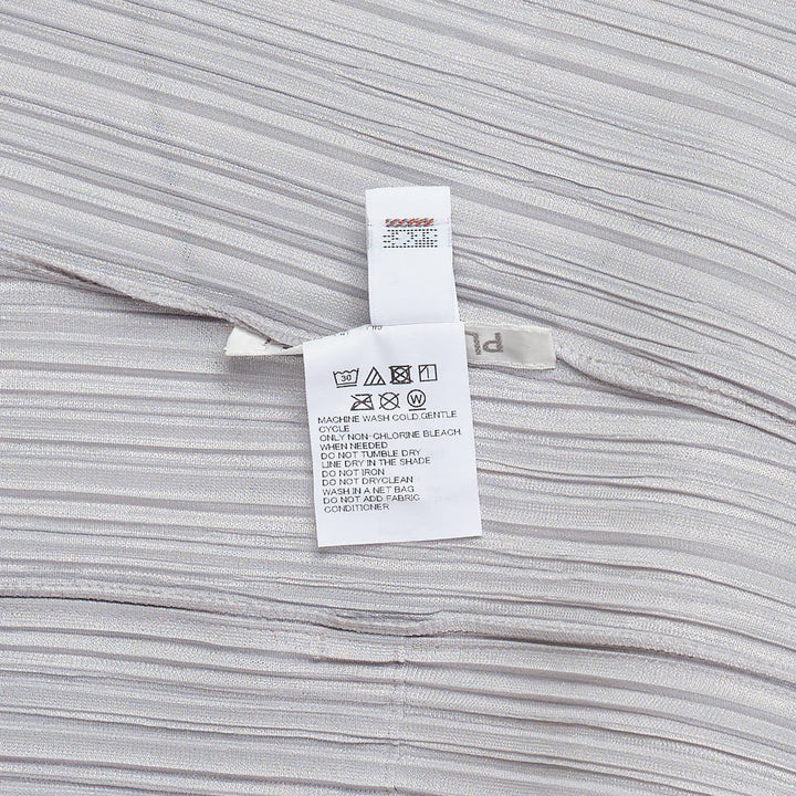 Pleats Please Issey Miyake Mellow Pleats Dress in silver-grey with fine vertical pleating, round neckline and short sleeves, midi length