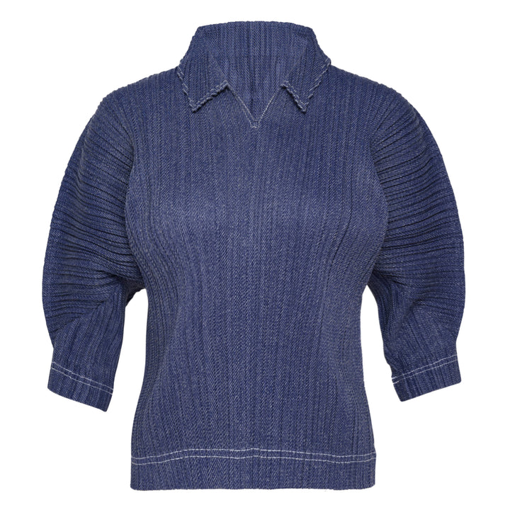 Pleats Please Issey Miyake Cotton Denim pleated top in indigo blue, featuring a notched mock neck, elbow-length sleeves, all-over vertical pleating, and contrast hem stitching — front view on white background