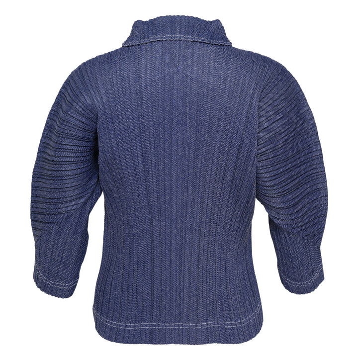 Pleats Please Issey Miyake Cotton Denim pleated top in indigo blue, featuring a notched mock neck, elbow-length sleeves, all-over vertical pleating, and contrast hem stitching — front view on white background