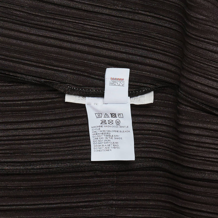 Pleats Please Issey Miyake Mellow Pleats Cardigan in black — rear view showing open-front silhouette with long sleeves and micro-pleated fabric