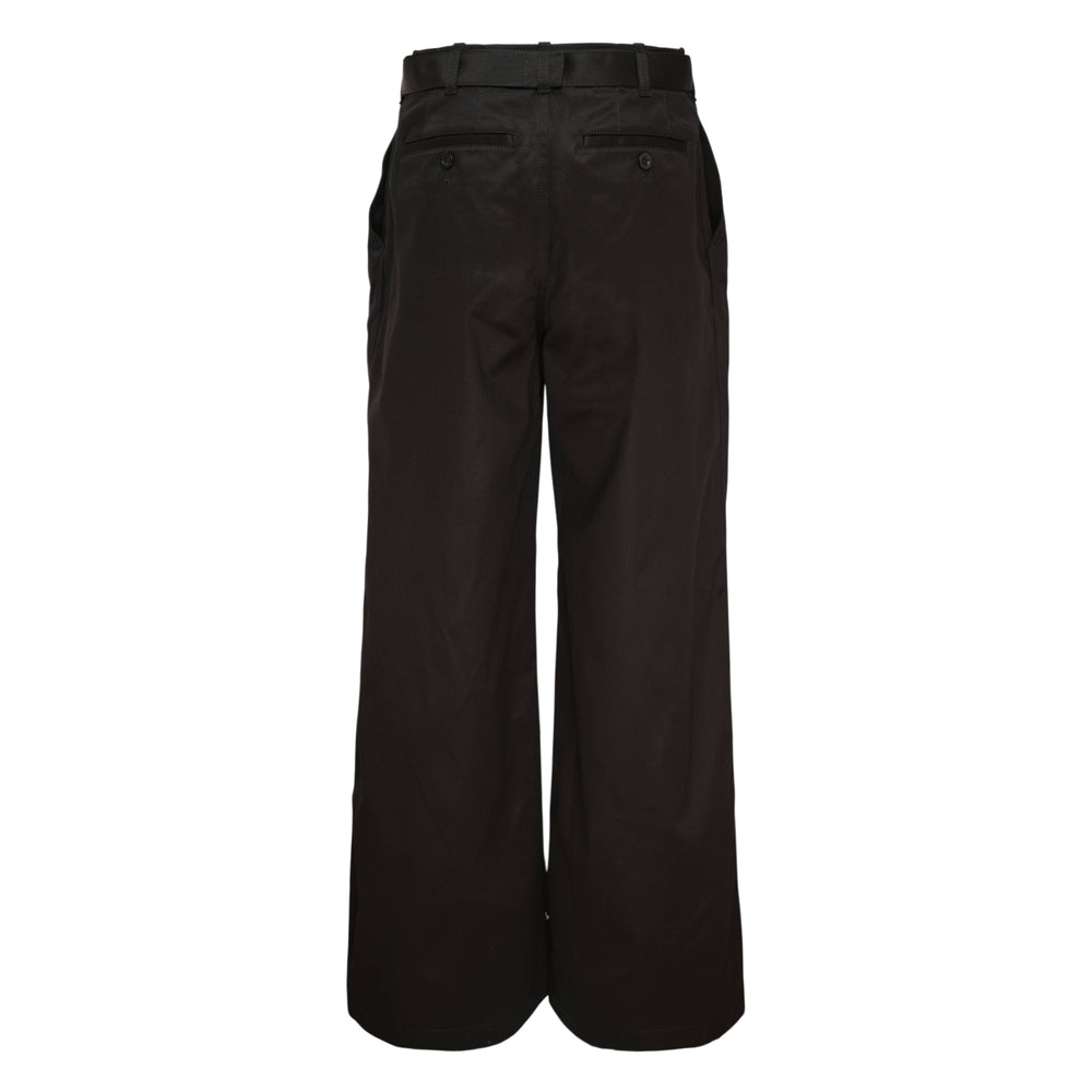 sacai belted cotton chino pants in khaki beige with wide-leg silhouette, high-rise waist, and integrated matching belt with metal buckle
