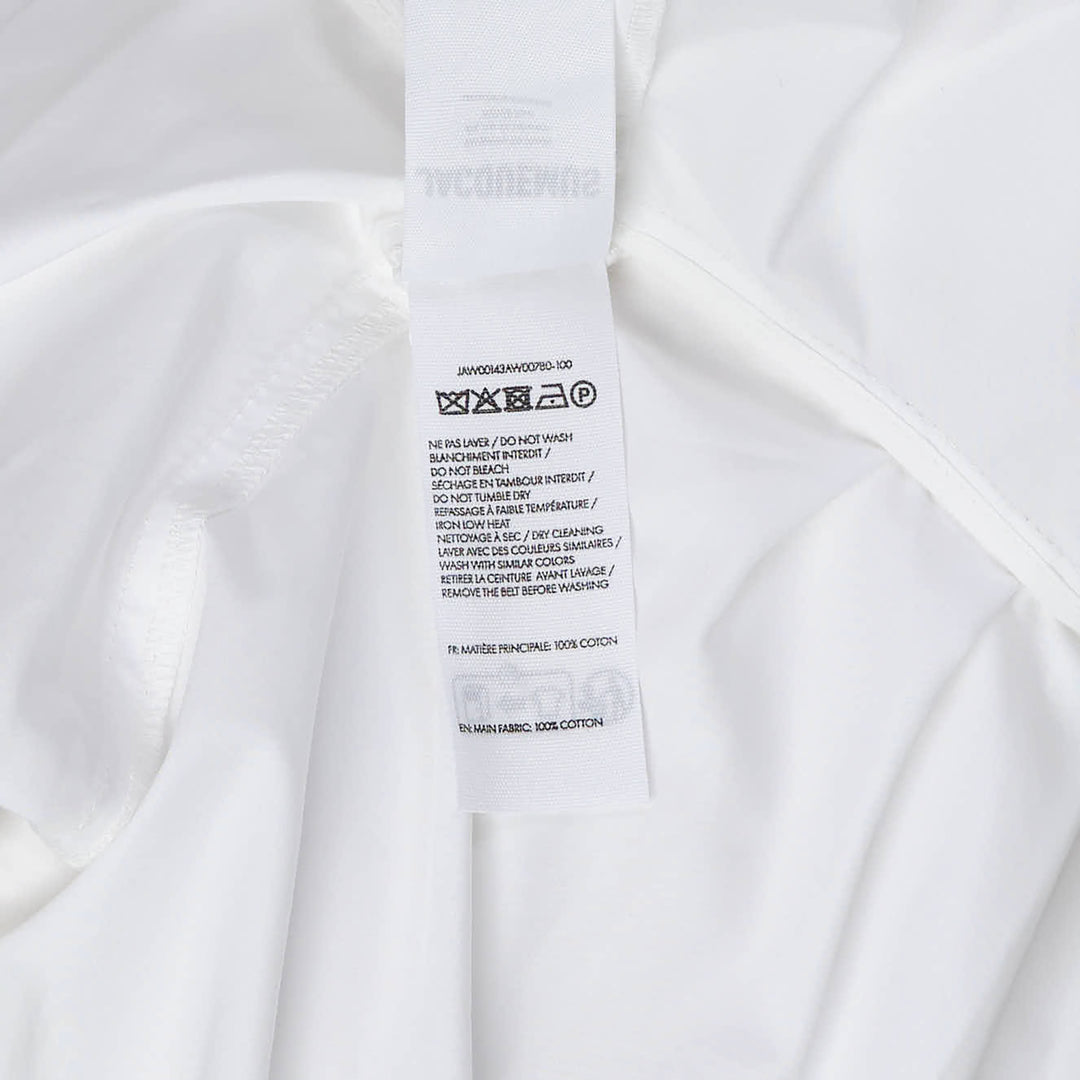 Jacquemus Cabana Woven Blouson in white with stand collar, wide long sleeves, and a self-tie belt, displayed flat on a white background