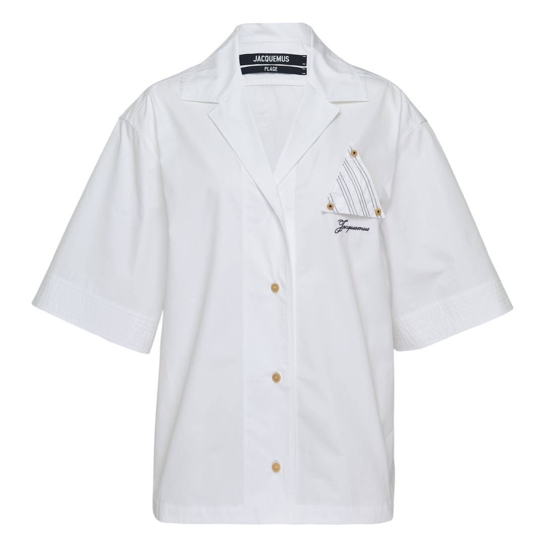 Jacquemus La Chemise Marin white woven short-sleeve camp collar shirt with gold buttons and embroidered logo chest pocket from the Plage collection