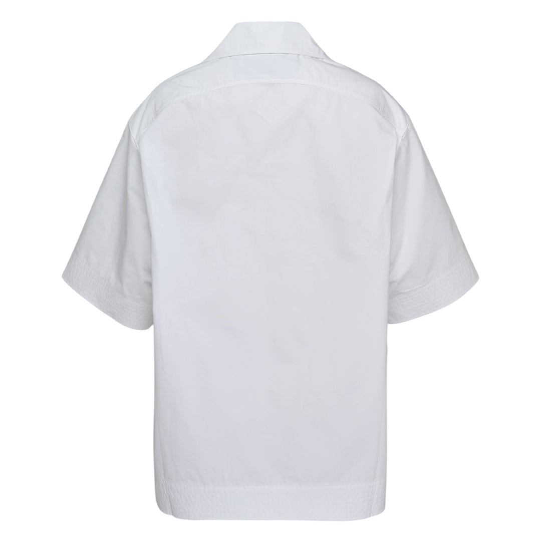 Jacquemus La Chemise Marin white woven short-sleeve camp collar shirt with gold buttons and embroidered logo chest pocket from the Plage collection