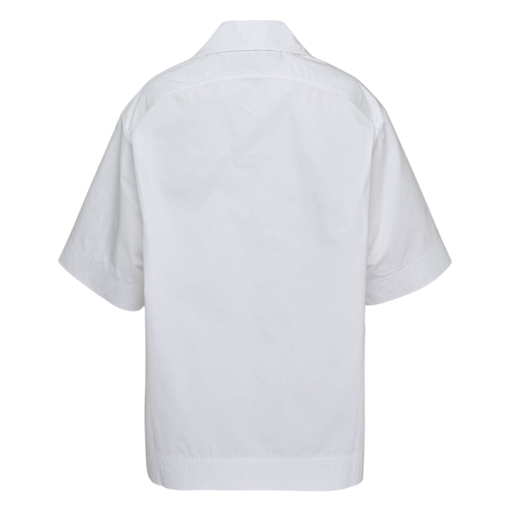 Jacquemus La Chemise Marin white woven short-sleeve camp collar shirt with gold buttons and embroidered logo chest pocket from the Plage collection