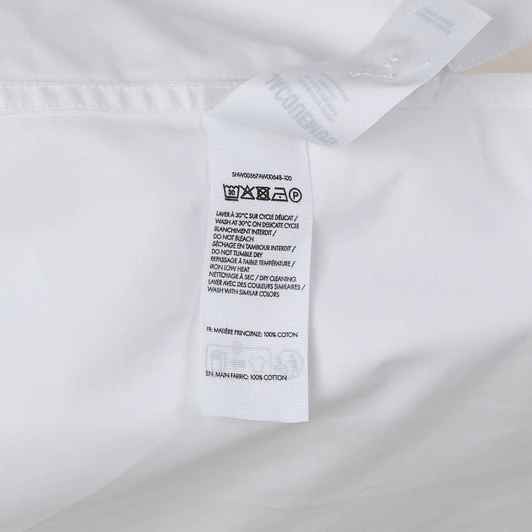 Jacquemus La Chemise Marin white woven short-sleeve camp collar shirt with gold buttons and embroidered logo chest pocket from the Plage collection