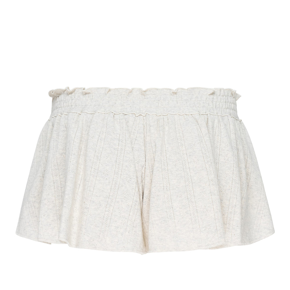 Glowny Honey Eyelet Shorts in heather grey with smocked high-rise waistband, ruffled lettuce-edge trim, and pleated flowy silhouette