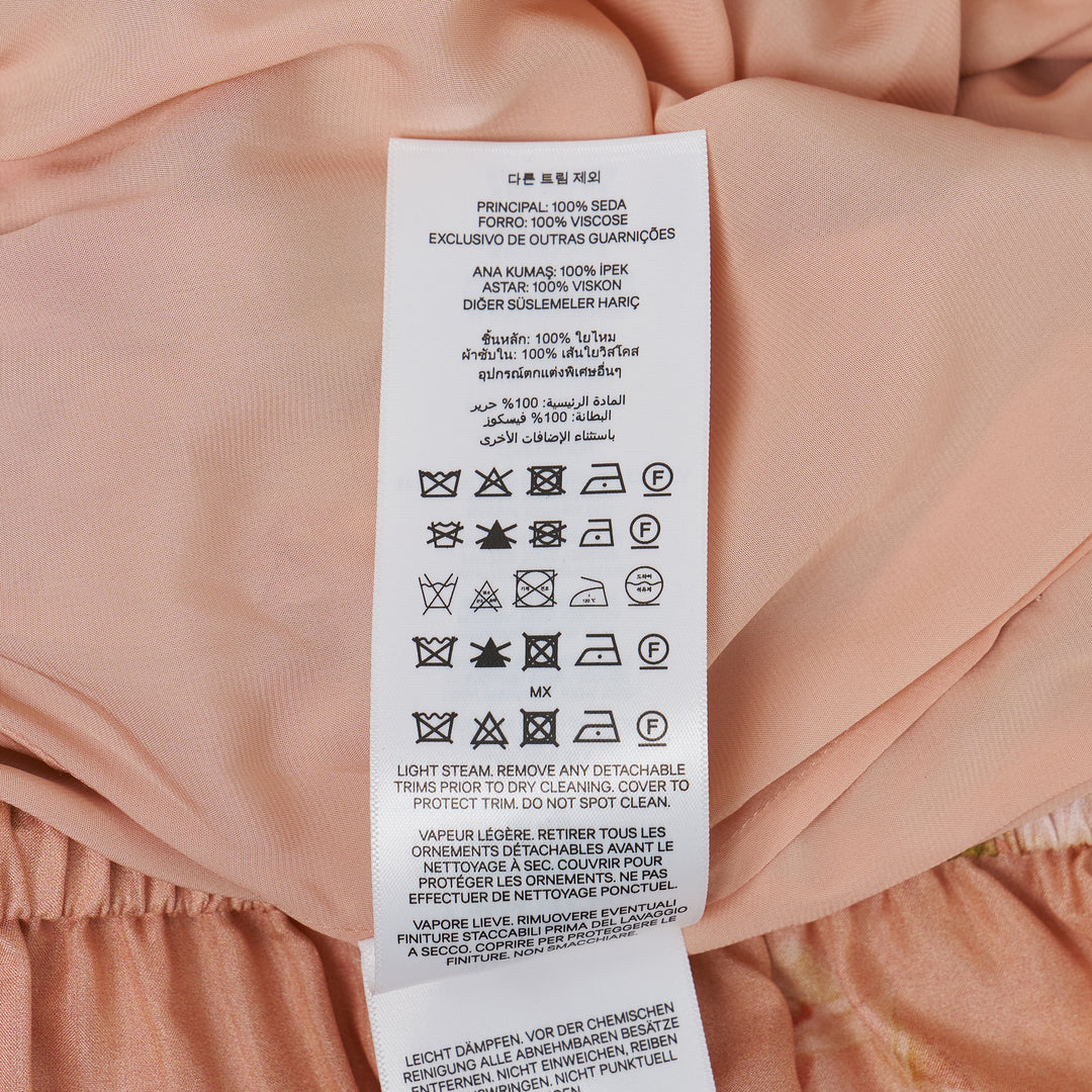 Zimmermann Roselight Frill Short in blush pink with red and pink rose floral print, elasticated drawstring waist with gold tassel ties and double ruffle hem