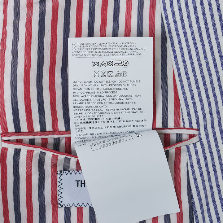 Thom Browne Classic Seersucker Sport Coat in blue and white stripe with three-button front and signature tricolor inner placket detail