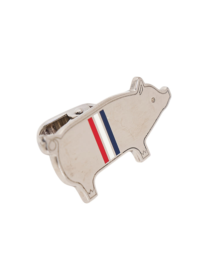 Thom Browne silver-tone pig-shaped tie bar with red, white, and blue enamel stripe and spring clip fastening