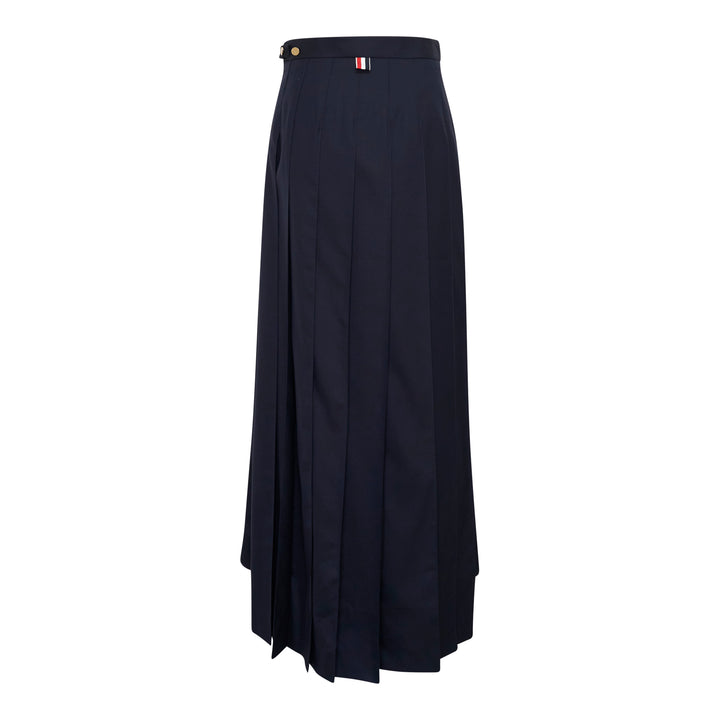 Thom Browne navy trouser-length knife-pleated skirt with high waist and signature red, white, and blue stripe trim at the hem