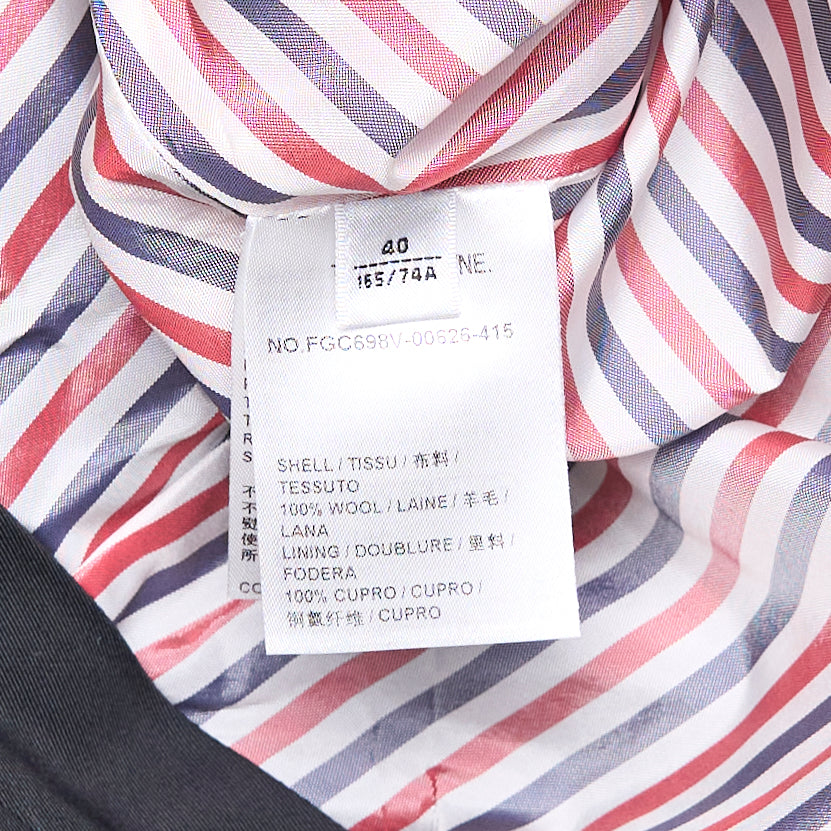 Thom Browne navy trouser-length knife-pleated skirt with high waist and signature red, white, and blue stripe trim at the hem