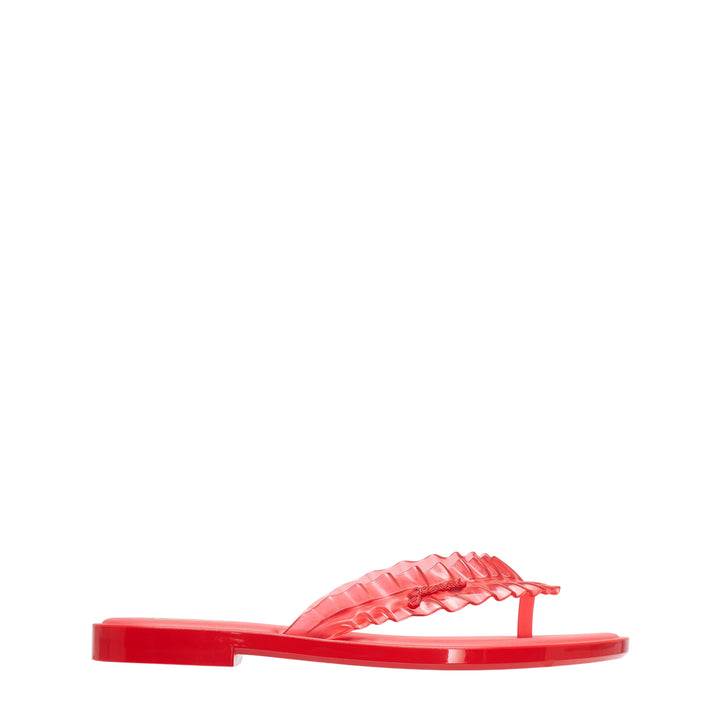 Ganni x Melissa red semi-translucent jelly ruffle thong flip flop with layered frill strap and flat moulded sole, side view